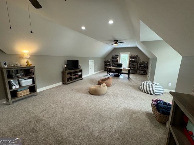 interior space featuring carpet, ceiling fan, and lofted ceiling