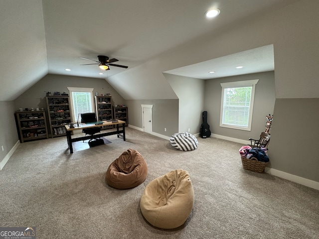 interior space with carpet, ceiling fan, and lofted ceiling