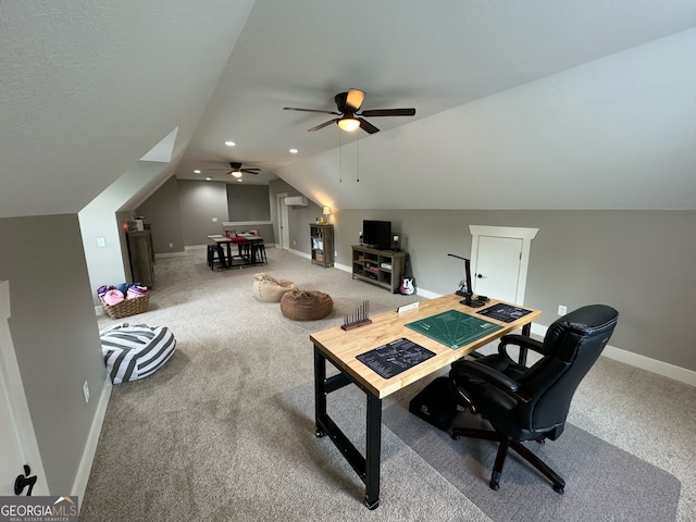 carpeted home office with lofted ceiling and ceiling fan