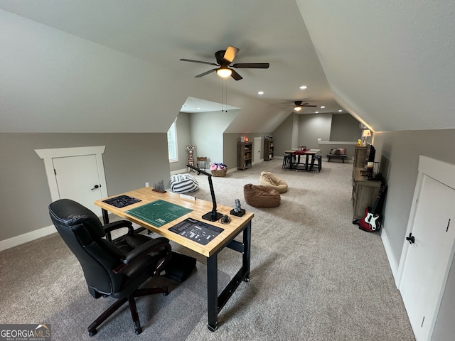 carpeted office with vaulted ceiling and ceiling fan