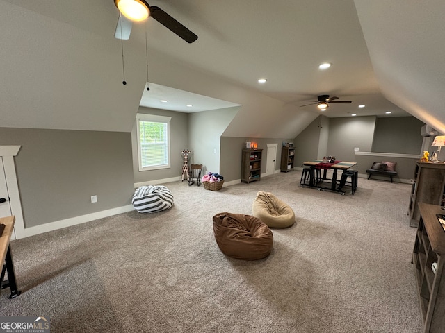 interior space featuring carpet, ceiling fan, and lofted ceiling