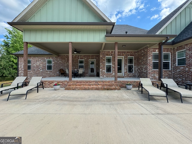 rear view of property with a patio and ceiling fan