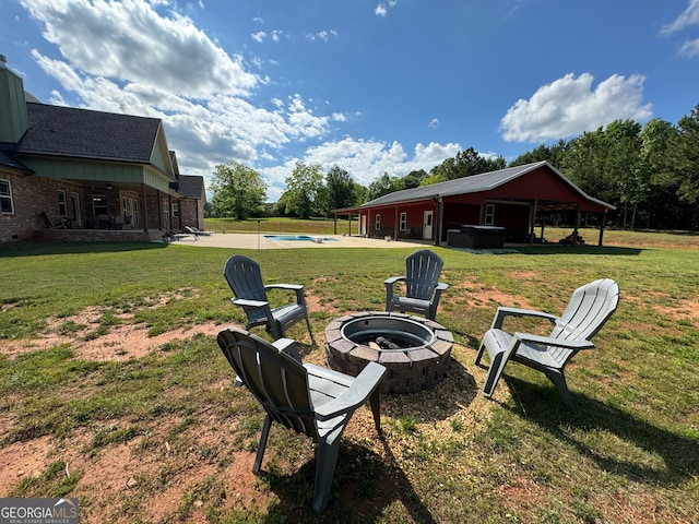 view of yard with a patio and an outdoor fire pit