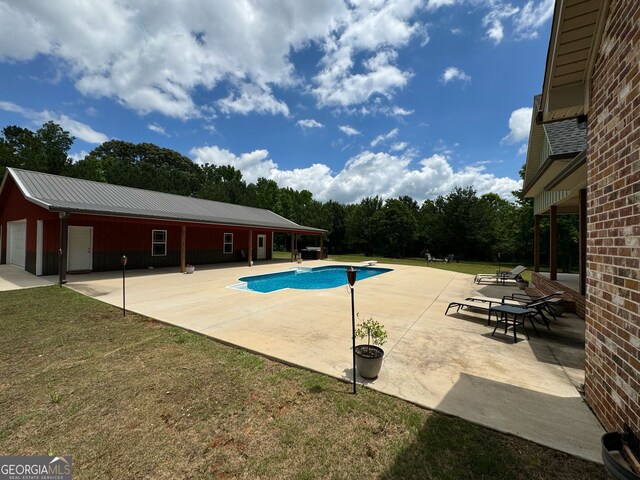 view of swimming pool featuring a patio area