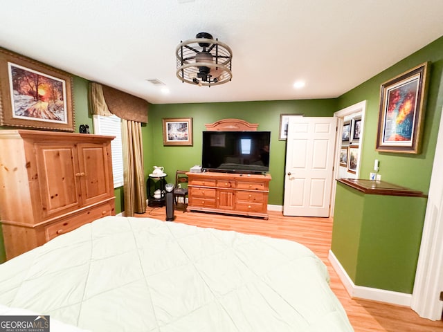 bedroom with light wood-type flooring