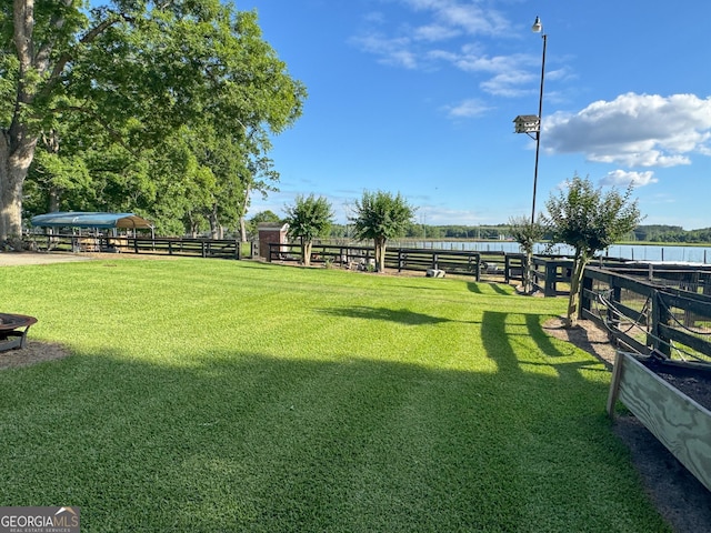 view of yard with a rural view