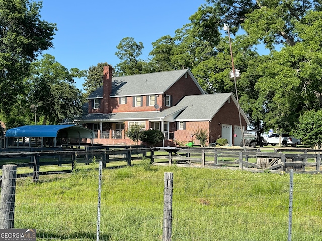 rear view of house featuring a carport