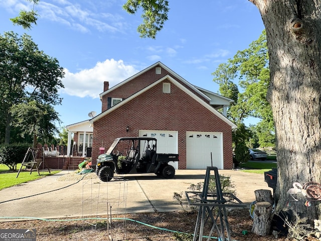 rear view of house with a garage