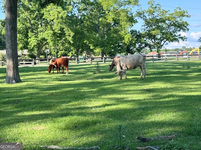 view of property's community with a lawn