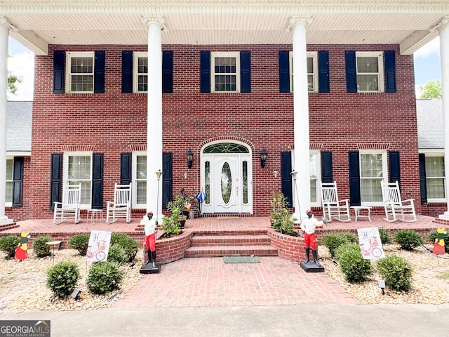 view of front of property featuring covered porch