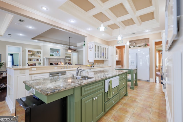 kitchen featuring white cabinets, sink, green cabinetry, and crown molding