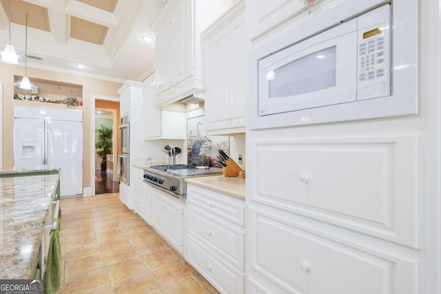 kitchen with crown molding, built in appliances, decorative light fixtures, coffered ceiling, and white cabinets