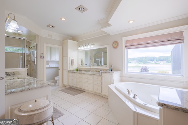 full bathroom featuring a healthy amount of sunlight, vanity with extensive cabinet space, separate shower and tub, and tile floors