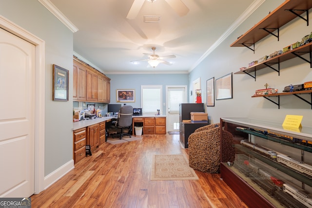 office area with ceiling fan, crown molding, and light wood-type flooring