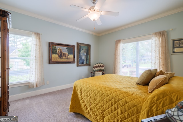 carpeted bedroom with ceiling fan and crown molding