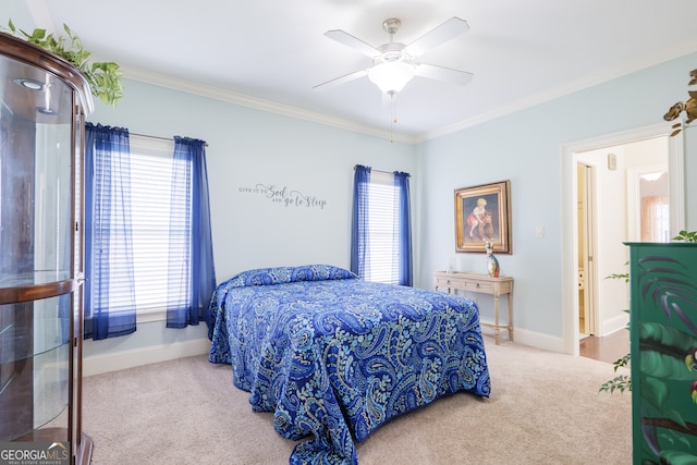 bedroom with ceiling fan, multiple windows, crown molding, and light carpet