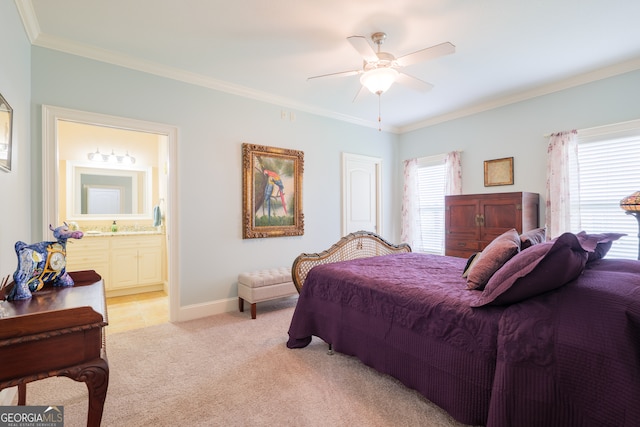 carpeted bedroom featuring ensuite bathroom, ceiling fan, and crown molding