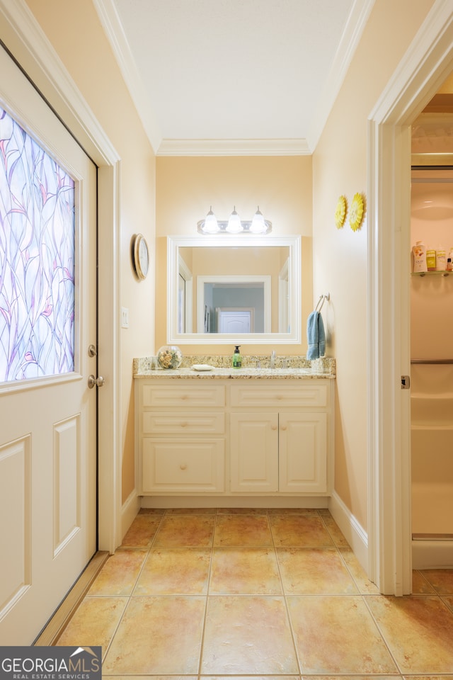 bathroom with vanity, tile floors, and ornamental molding