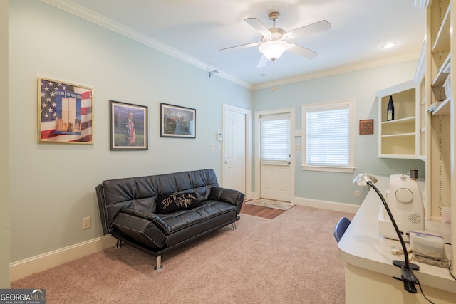 living area with light carpet, crown molding, and ceiling fan