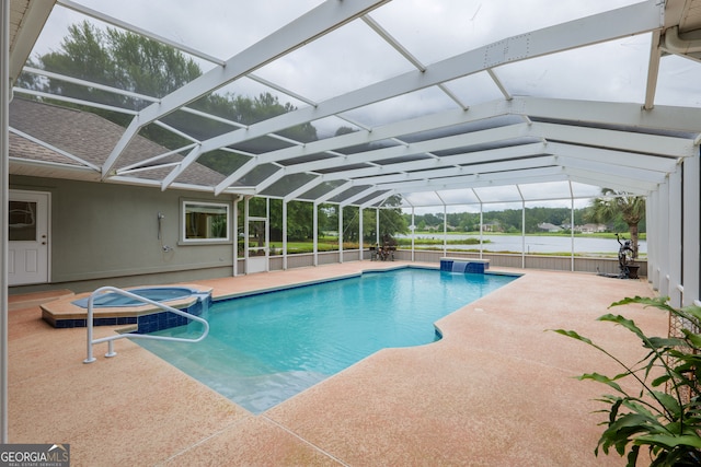 view of swimming pool featuring a patio and glass enclosure