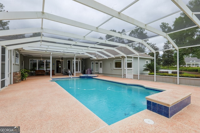 view of pool featuring a patio and glass enclosure