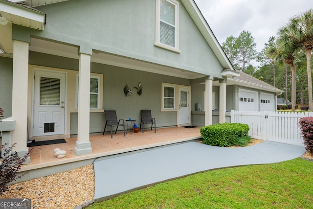 back of property with covered porch