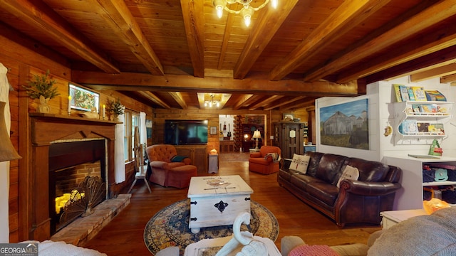 living room featuring a fireplace, beamed ceiling, wooden walls, dark hardwood / wood-style flooring, and wooden ceiling