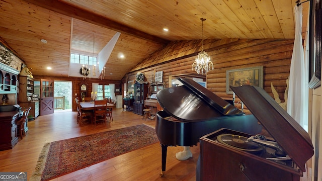 misc room with vaulted ceiling with beams, rustic walls, a notable chandelier, wooden ceiling, and light hardwood / wood-style flooring