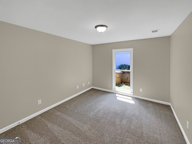 unfurnished room featuring carpet floors