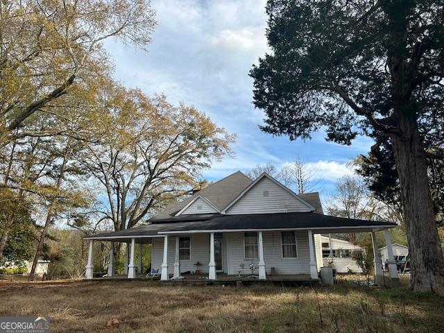 farmhouse inspired home with covered porch