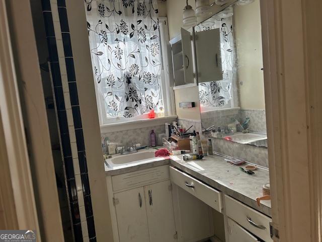 kitchen with sink and white cabinetry