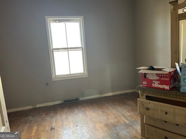 interior space with dark hardwood / wood-style floors