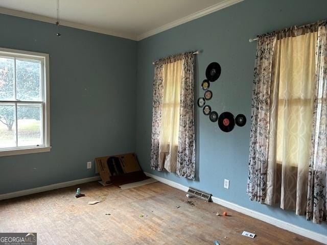 spare room with crown molding