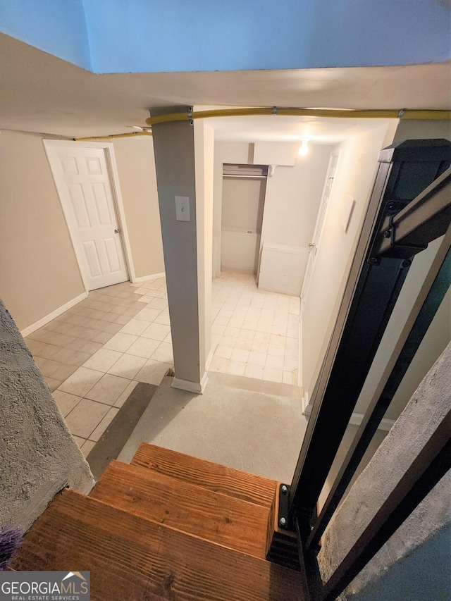 stairs featuring tile patterned floors