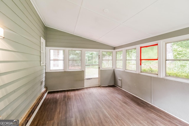 unfurnished sunroom featuring vaulted ceiling