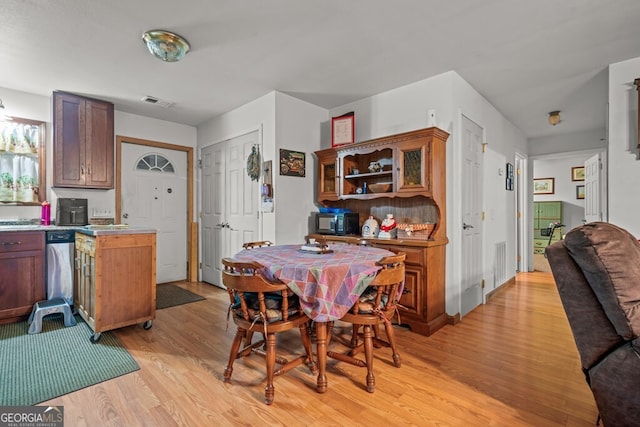 dining room with light hardwood / wood-style flooring