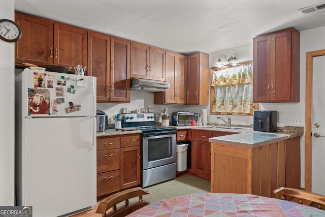 kitchen with light carpet, sink, electric range, and white fridge