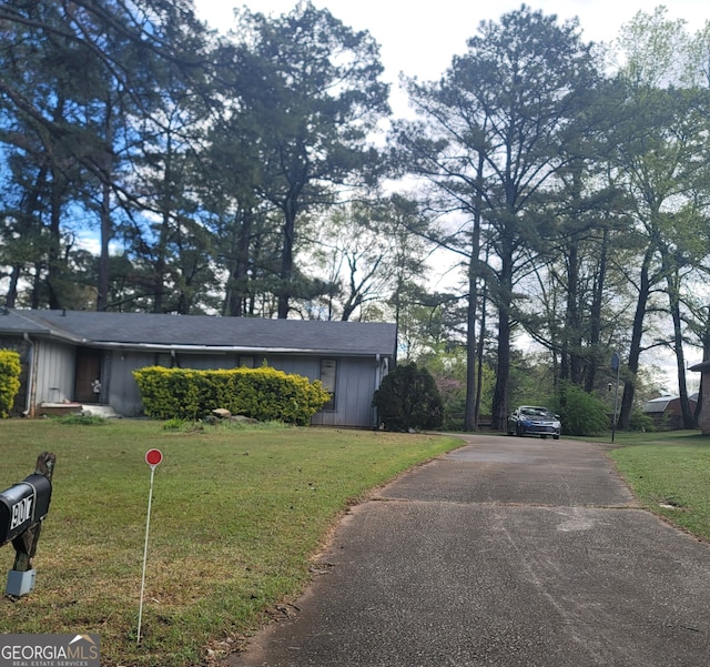 view of home's exterior with a lawn