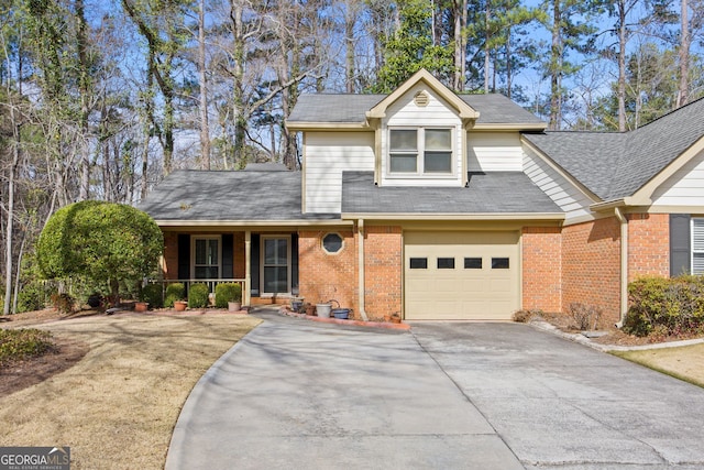 view of front of property featuring a garage, brick siding, covered porch, and driveway