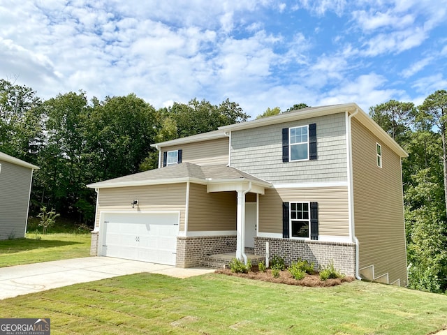 view of front of home with a front yard and a garage