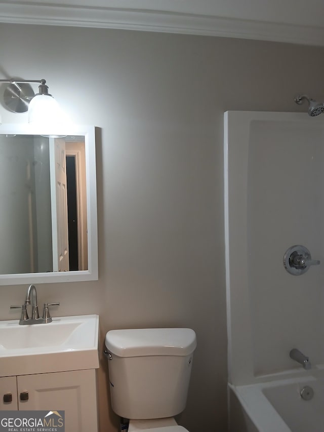 full bathroom with ornamental molding, tub / shower combination, vanity, and toilet