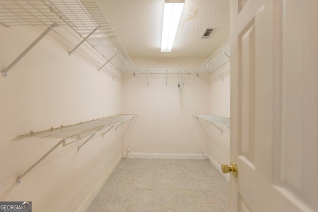 3650 Confederate Dr, Macon, GA 31211 - walk in closet with light tile flooring