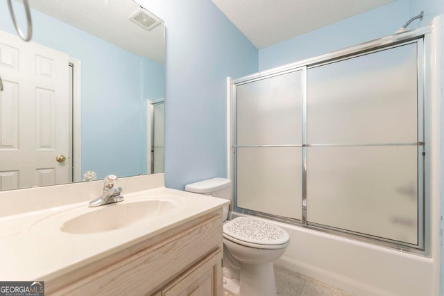 3650 Confederate Dr, Macon, GA 31211 - full bathroom featuring tile flooring, enclosed tub / shower combo, vanity, and toilet