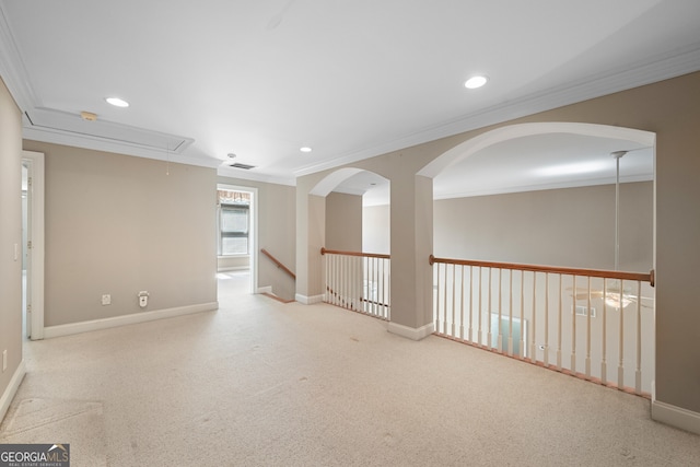 carpeted spare room with crown molding