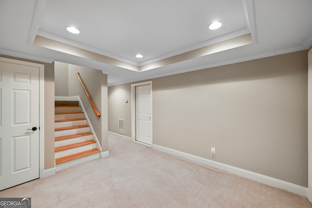 basement featuring ornamental molding and light colored carpet