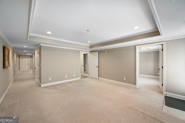 basement featuring ornamental molding and light colored carpet