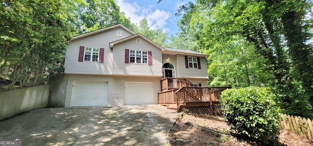 raised ranch with a deck and a garage