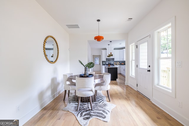 dining room with light hardwood / wood-style flooring