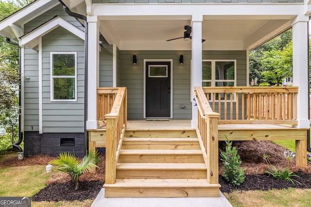 entrance to property with ceiling fan and a porch