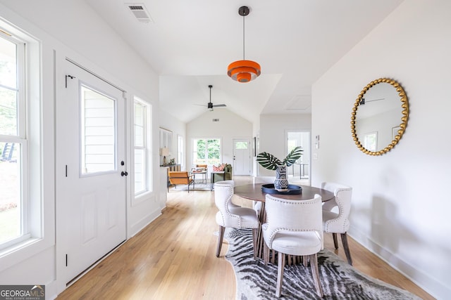 kitchen featuring white cabinets, decorative light fixtures, backsplash, gas range, and sink